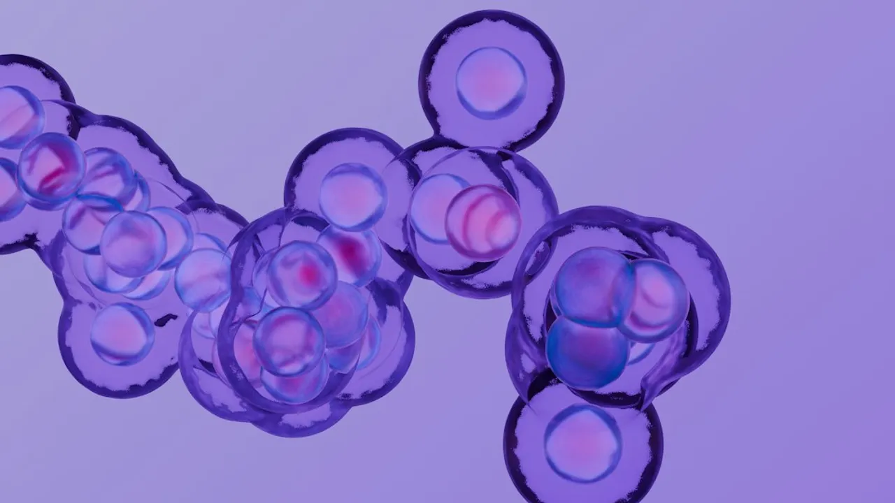 A cluster of translucent purple cells with glowing pink nuclei on a purple background