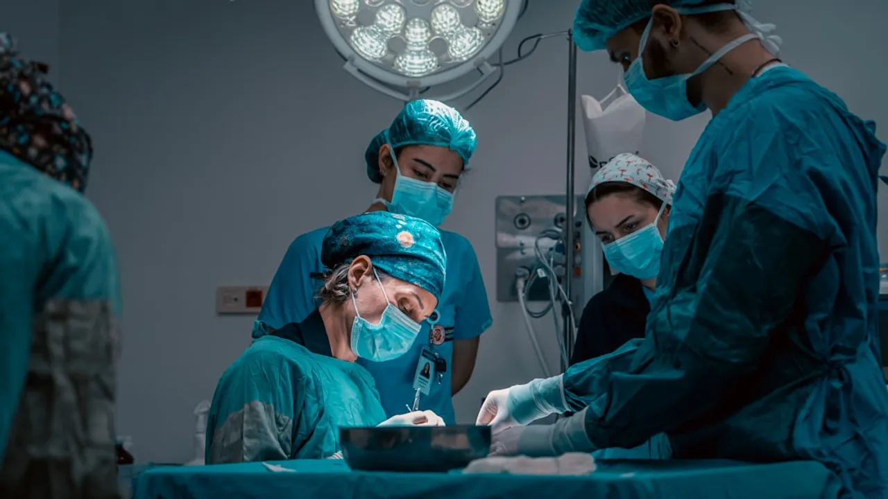 a group of doctors performing surgery on a patient