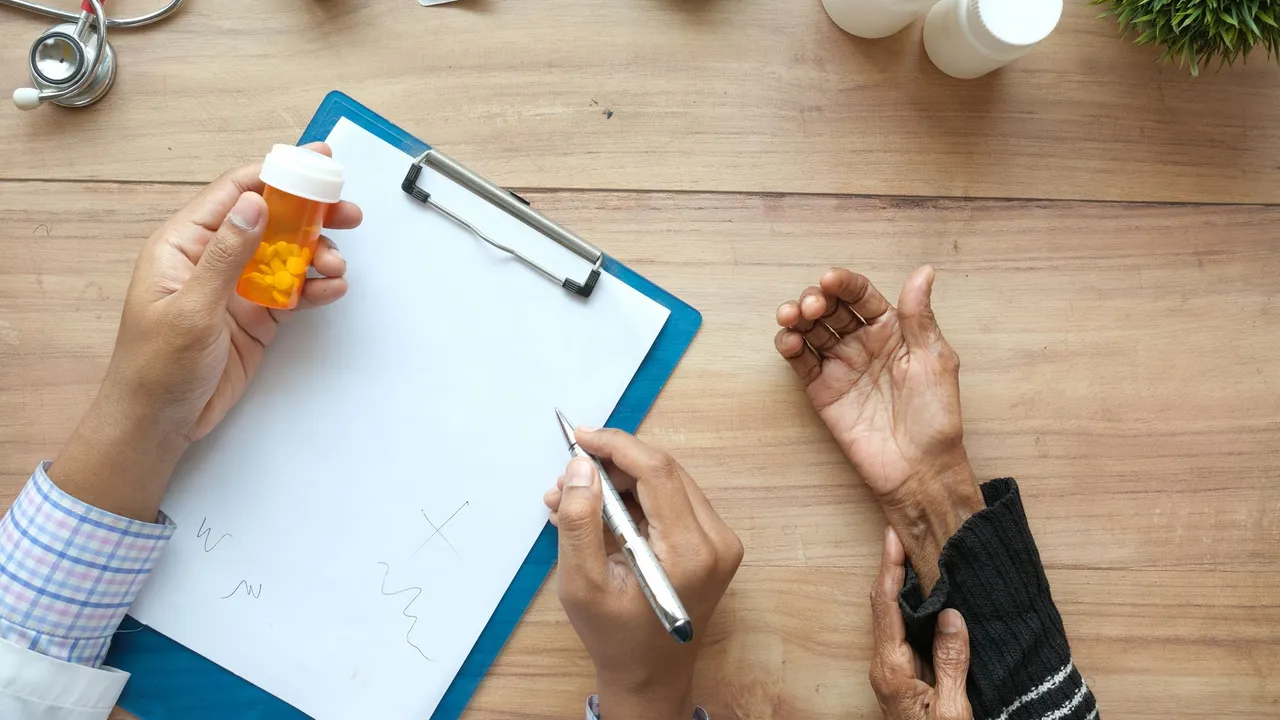 A doctor holds a pill bottle while consulting with an elderly patient. A stethoscope and prescriptions are visible.