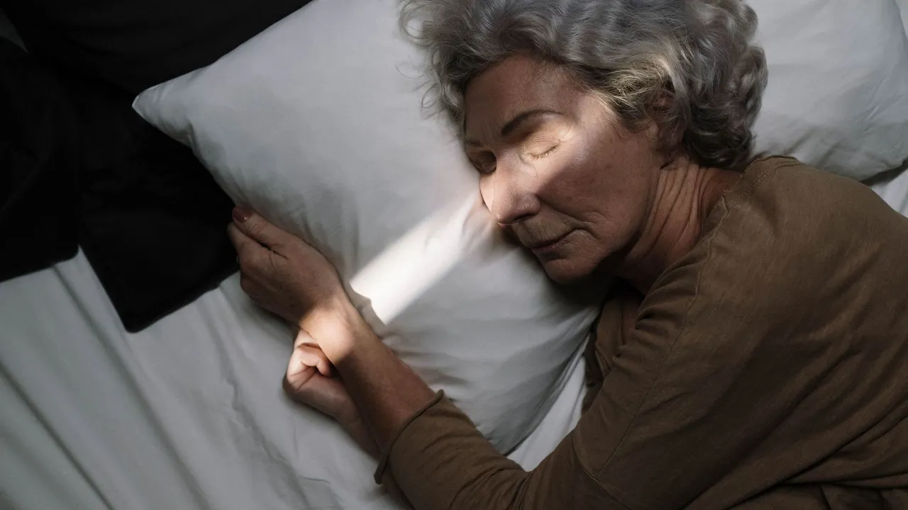A serene moment of an elderly woman peacefully sleeping on a bed with soft lighting.